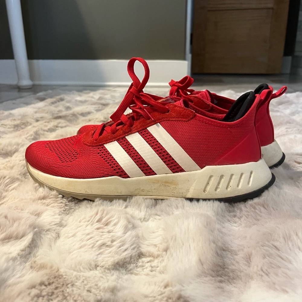 Men’s red adidas running shoes